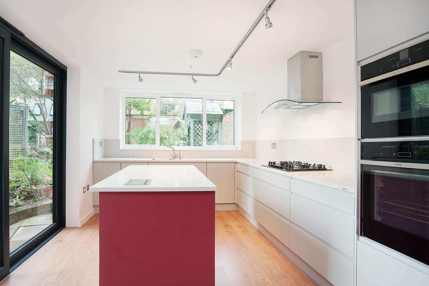 a kitchen with a sink and a window