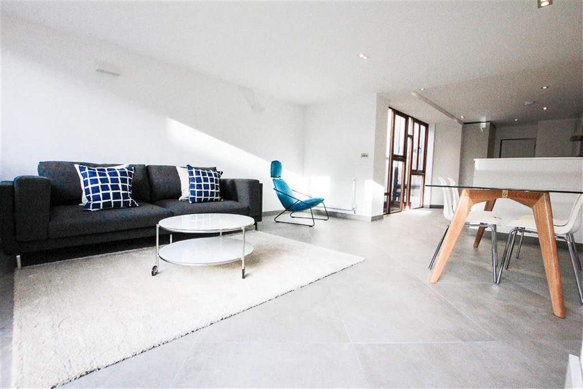 a living room with a wooden floor