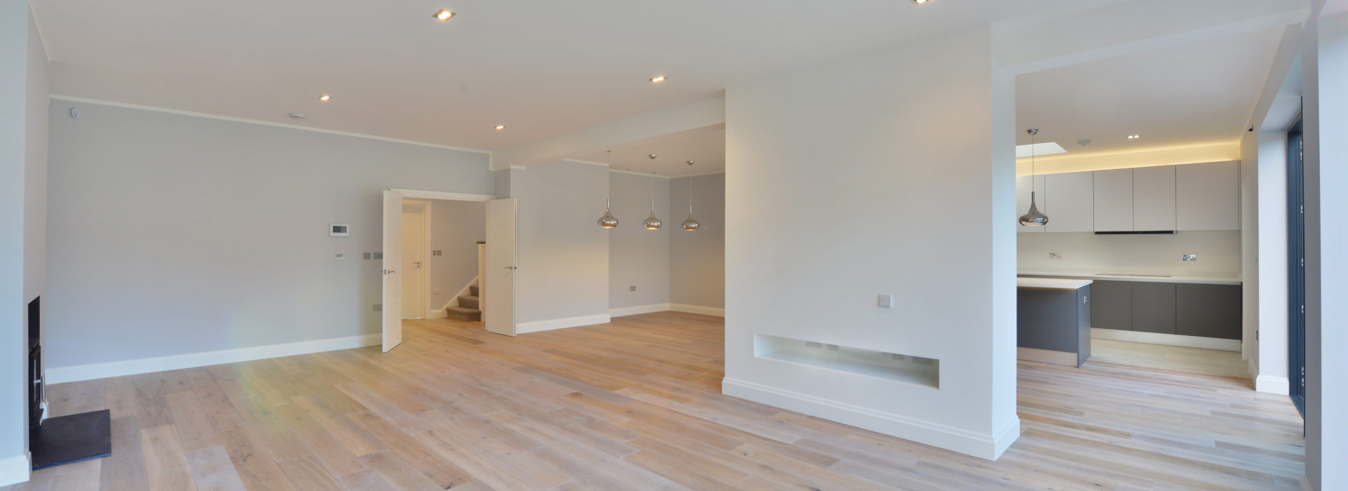 a kitchen with a wood floor