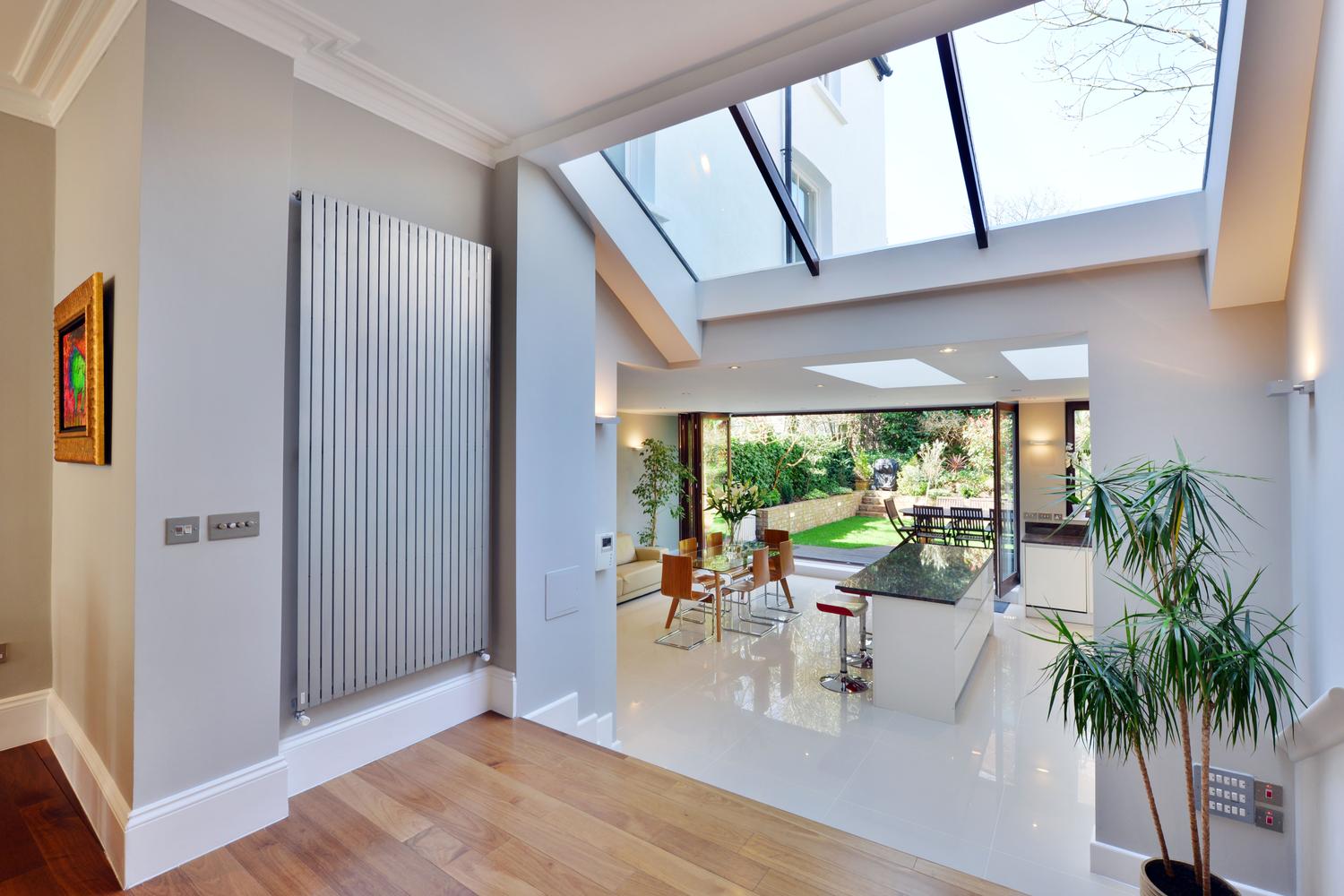 a living room filled with furniture and a large window