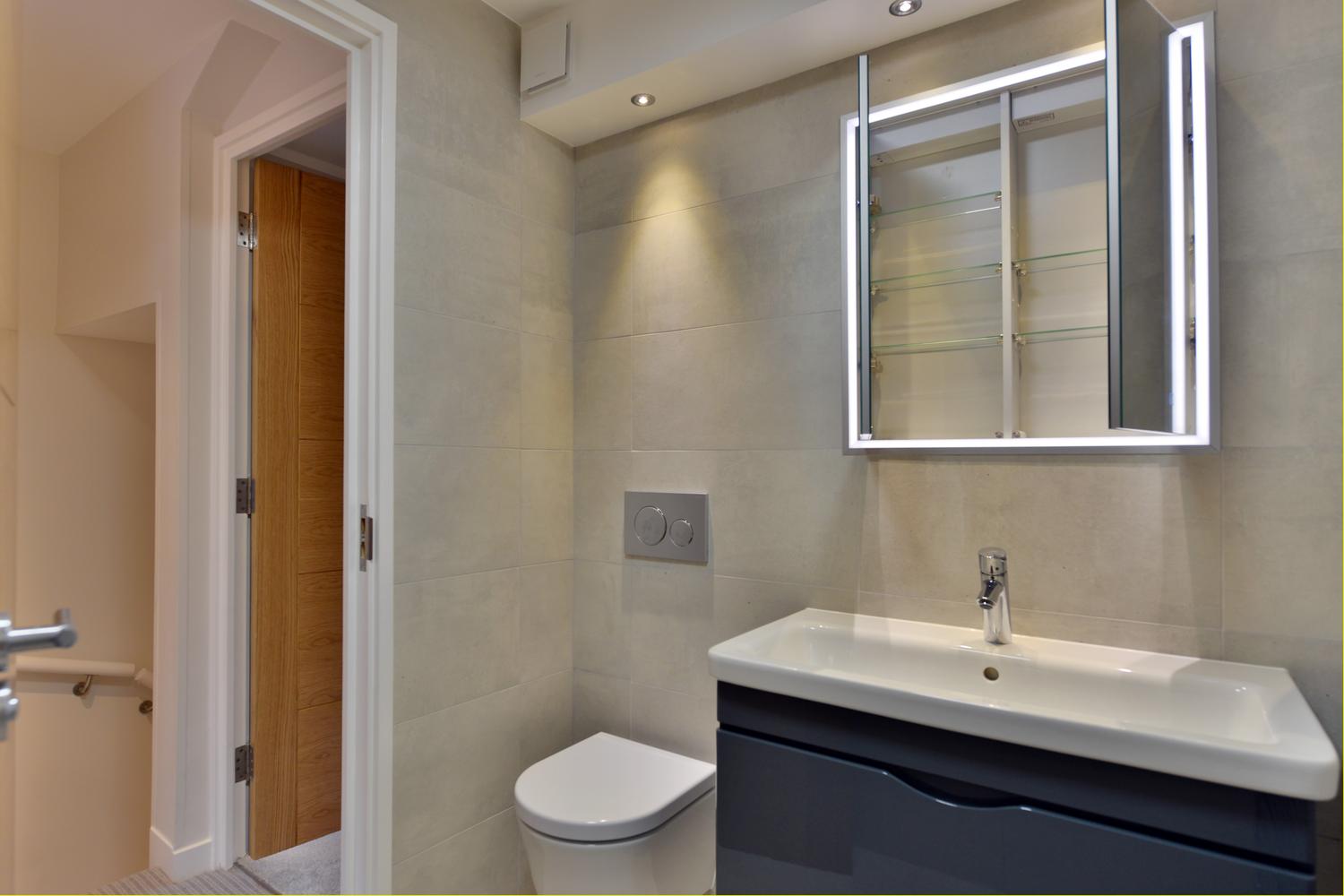 a shower that has a sink and a mirror