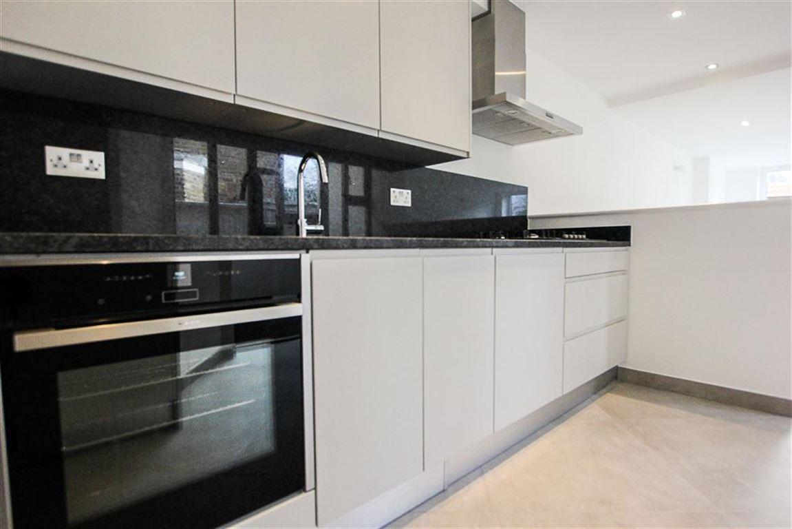 a kitchen with stainless steel appliances