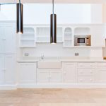 a kitchen with wooden cabinets