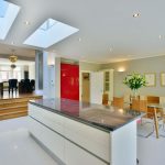 a kitchen with an island in the middle of a room