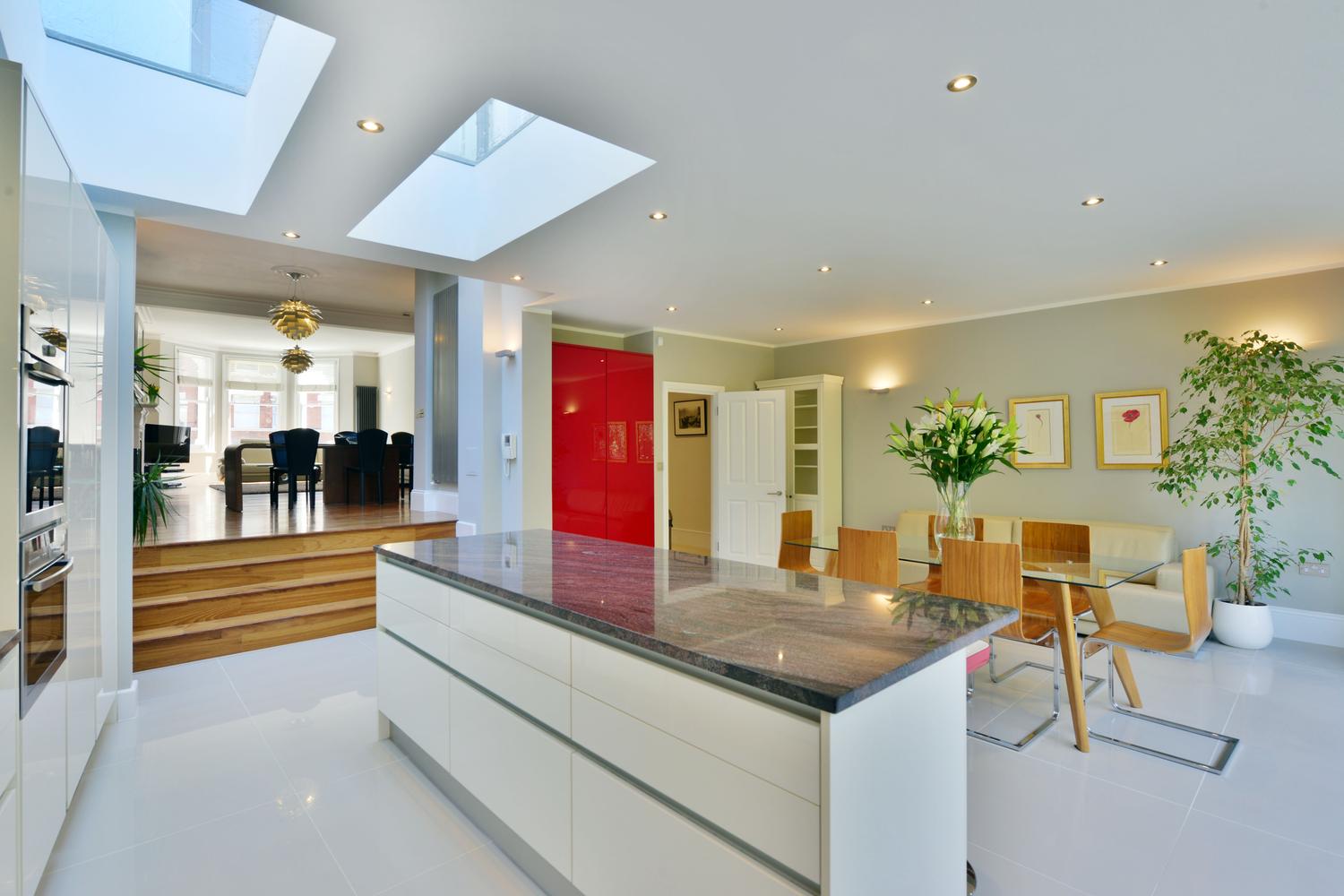 a kitchen with an island in the middle of a room