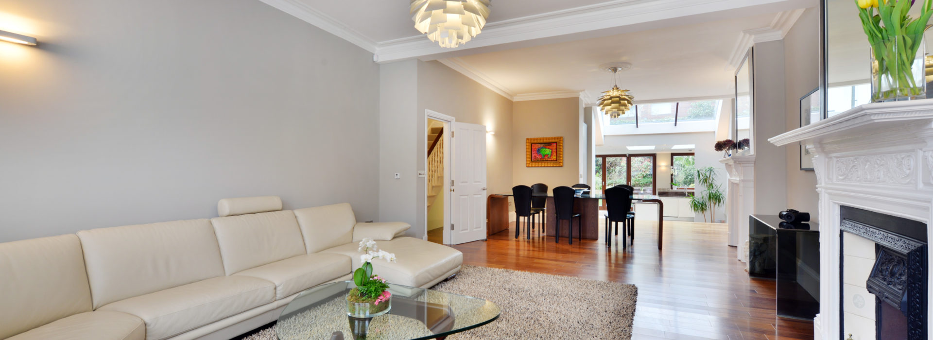 a living room filled with furniture and a fireplace