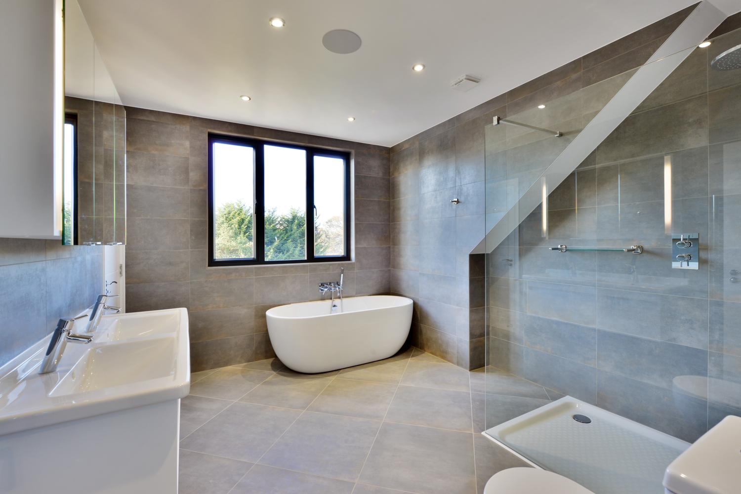 a room with a large tub next to a sink