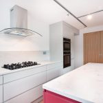 Kitchen design with an extractor hood