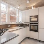 Kitchen design with white handleless cabinets