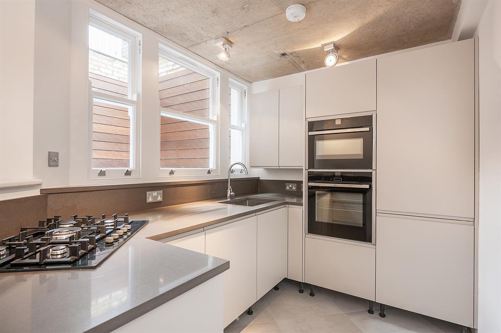 Kitchen design with white handleless cabinets