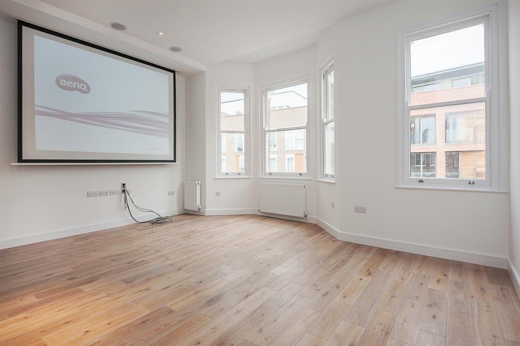 a close up of a hard wood floor next to a window