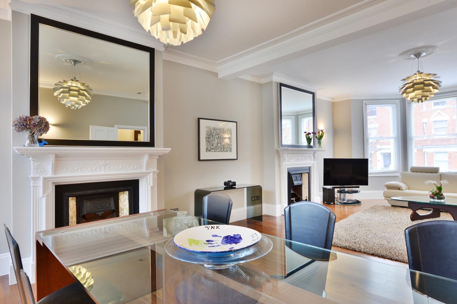 a living room filled with furniture and a flat screen tv