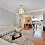 a living room filled with furniture and a fireplace