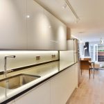 a kitchen with a wood floor