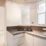 a kitchen with a sink and a window