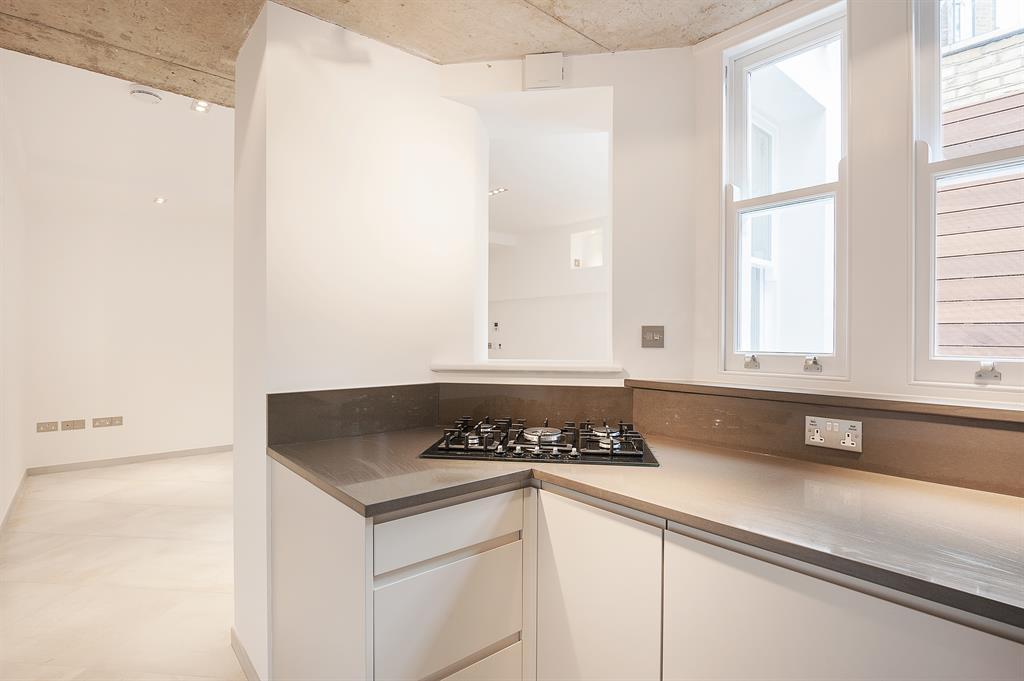 a kitchen with a sink and a window