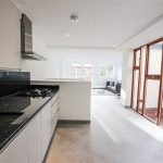 a kitchen with a wood floor