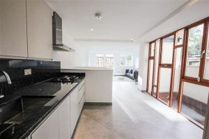 a kitchen with a wood floor