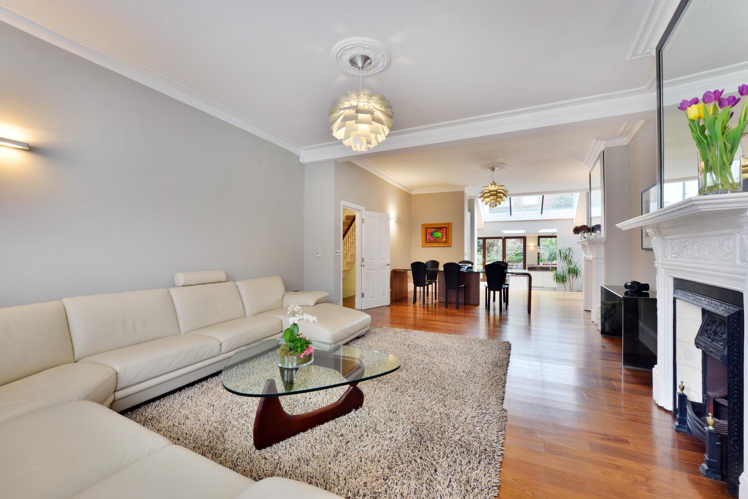 a living room filled with furniture and a fireplace