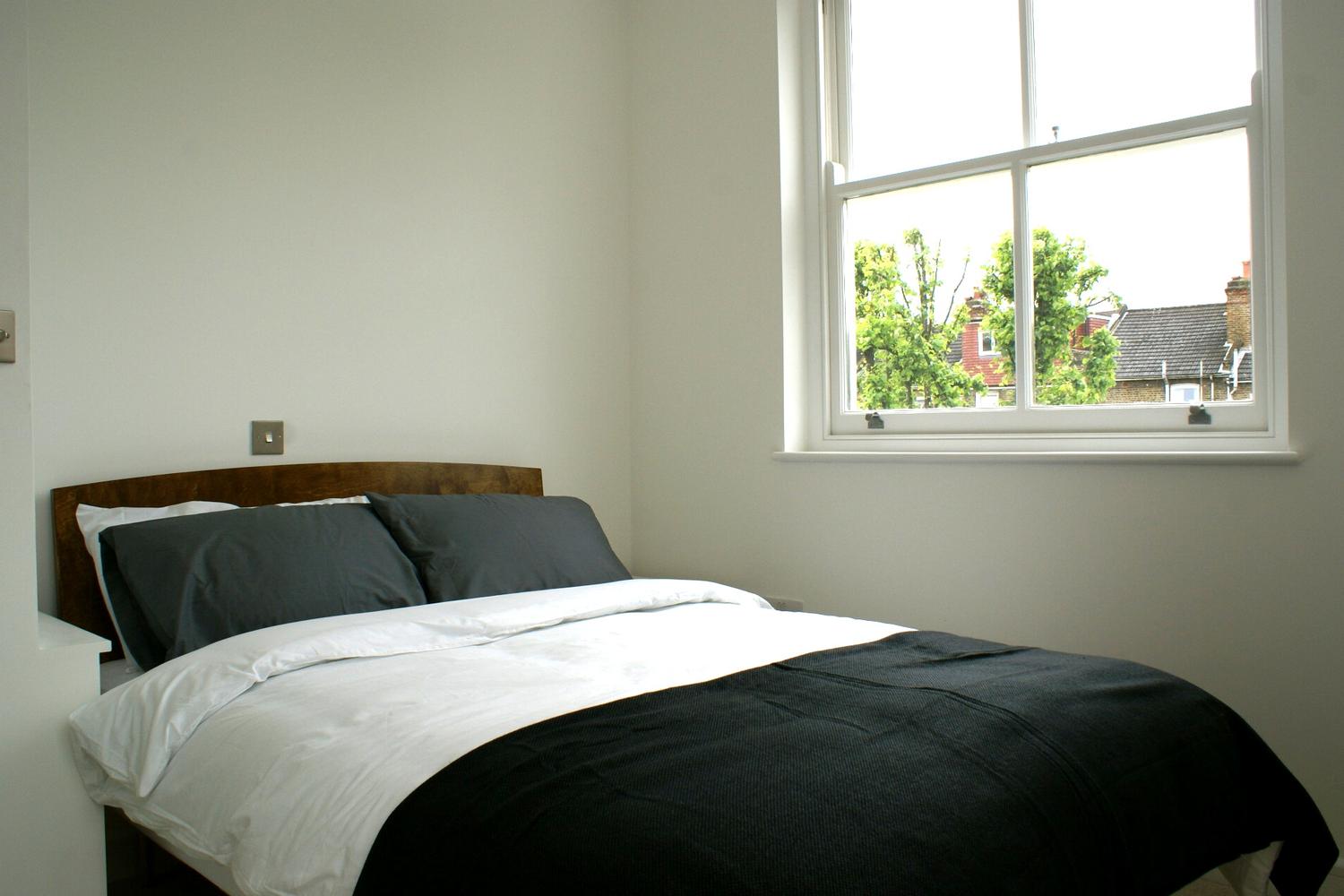 a bedroom with a bed in a hotel room