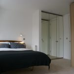 a bedroom with a bed in a room