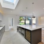 a kitchen with an island in the middle of a room