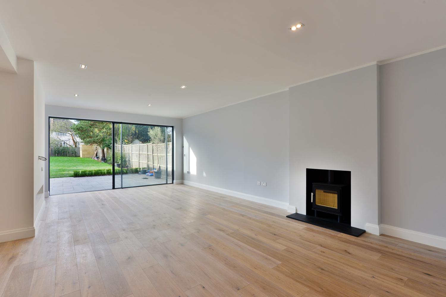 a living room filled with furniture and a flat screen tv