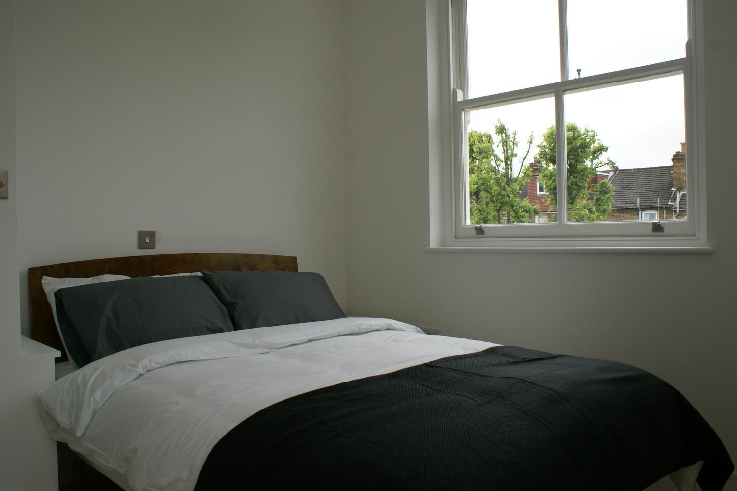 a bedroom with a bed in a hotel room