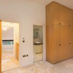 a kitchen with a sink and a mirror