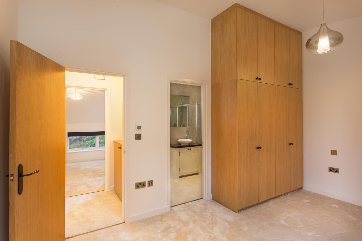 a kitchen with a sink and a mirror